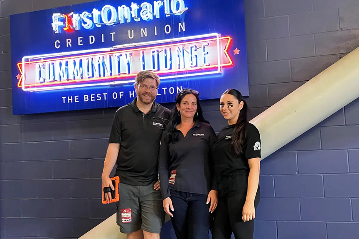Three FirstOntario Blue Wave volunteers in the Community Lounge.