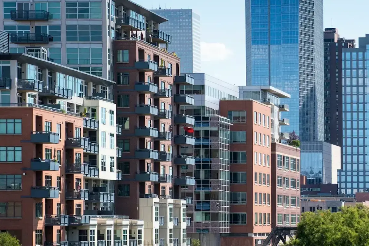 Modern downtown condo buildings representing community investment and financial planning.