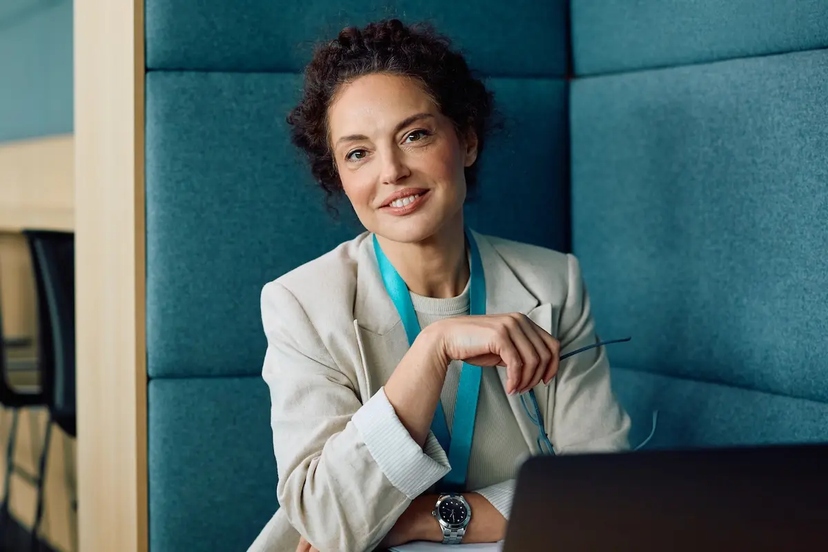Business professional using a laptop in an office, managing cheque deposits with Corporate Capture.